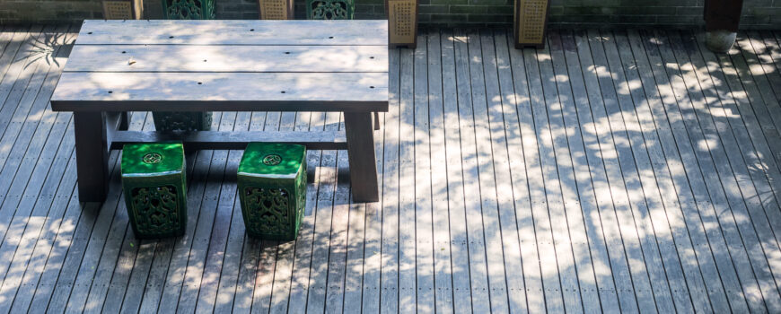 chairs and a table in a small wood platform